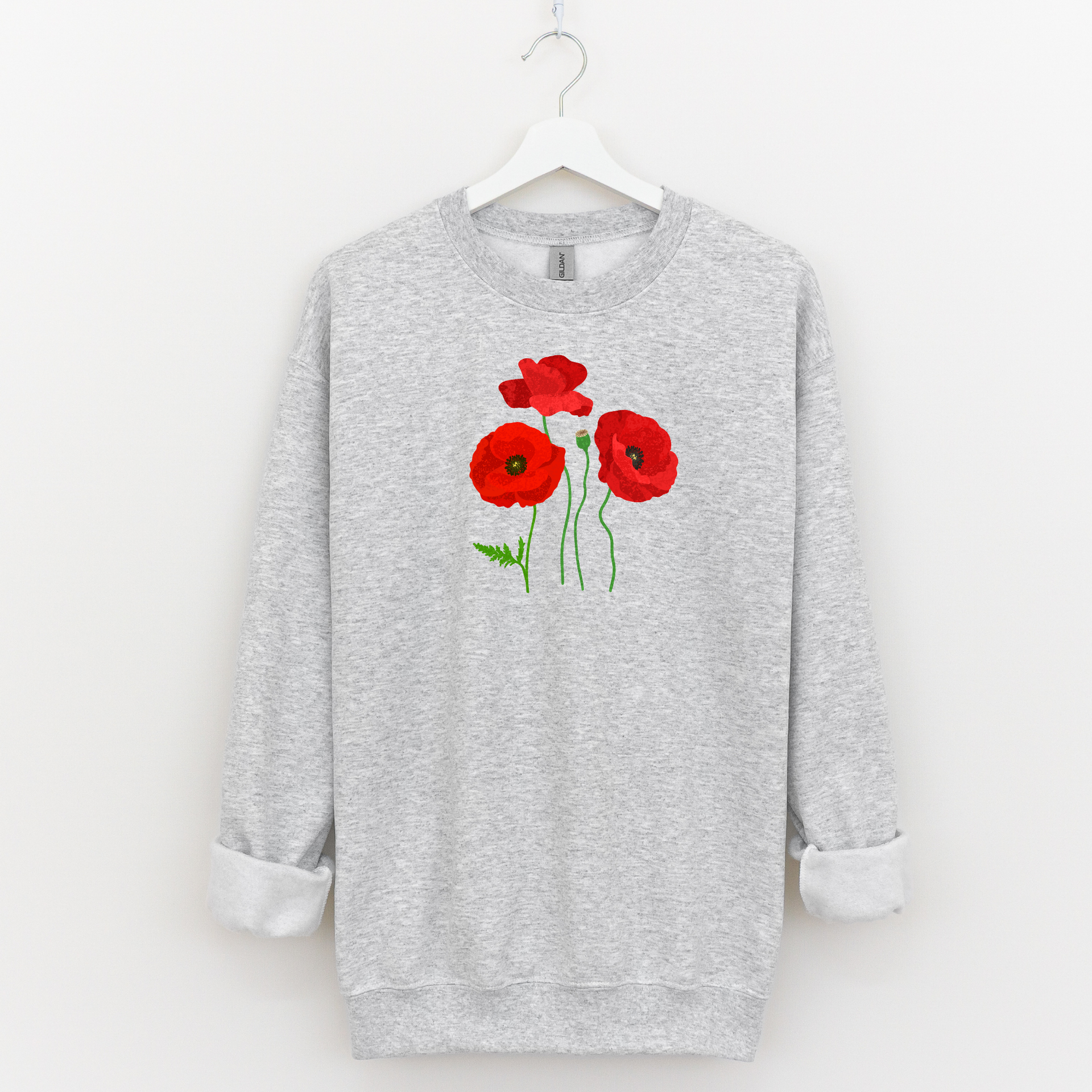 Gray sweatshirt with 1 in 4 red poppy flower design on a white background