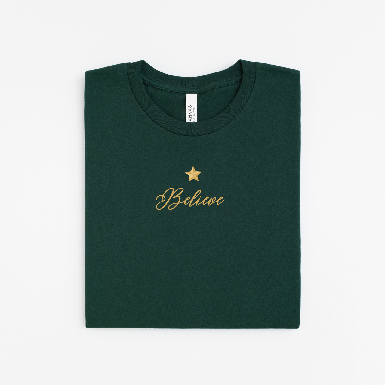 Green t-shirt with 'Believe' and a star in gold on a white background